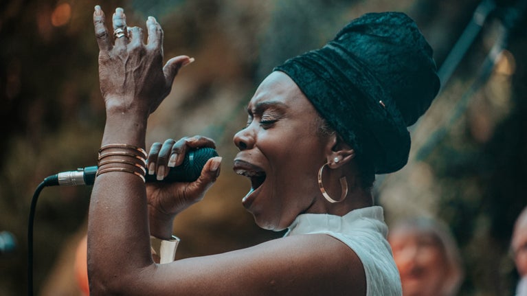 A woman performs in the Falmouth Community Gospel Choir